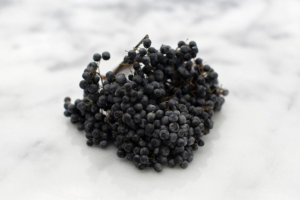 elderberry cluster on marble surface