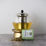 Carmel Berry Elderflower Comfort Tea in tin and tea pot