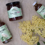 Carmel Berry Elderflower Pluot Preserves jar and Elderflower Syrup bottles