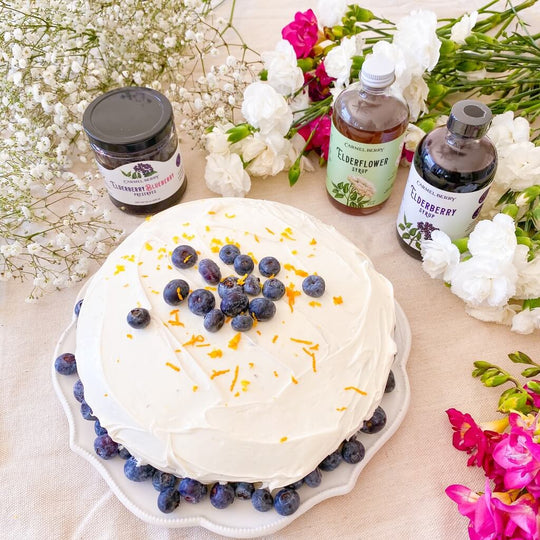 cake with elderberry jam filling and elderflower icing