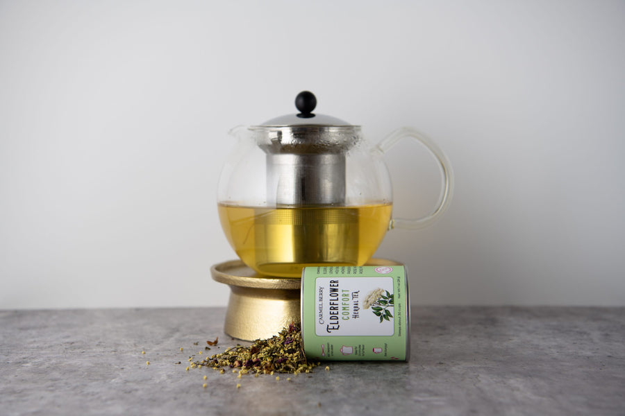 Carmel Berry Elderflower Comfort Tea in tin and tea pot